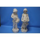 A PAIR OF PLASTER FIGURINES, GIRL WITH PUPPIES AND GIRL WITH KITTENS