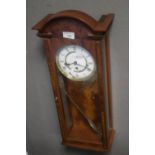 A HANGING WALLCLOCK