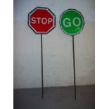 A PAIR OF VINTAGE STOP/GO ROAD WORK LOLLIPOP SIGNS