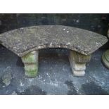 A HEAVY RECONSTITUTED STONE CRESCENT SHAPED TWIN PEDESTAL SEAT