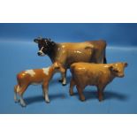 A BESWICK JERSEY COW, A BESWICK GUERNSEY CALF AND A BESWICK HIGHLAND CALF (3)