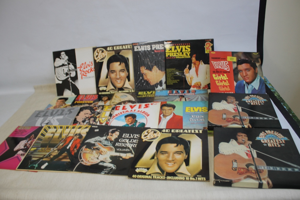 TWENTY-SIX ELVIS PRESLEY LP RECORDS together with two Elvis boxed sets of six albums