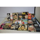 TWENTY-SIX ELVIS PRESLEY LP RECORDS together with two Elvis boxed sets of six albums