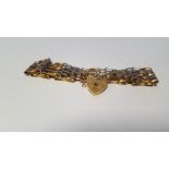 A 9 CT GOLD GATE BRACELET 10.4 g