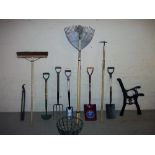 A QUANTITY OF MOSTLY NEW GARDEN TOOLS AND A PAIR OF CAST BENCH ENDS