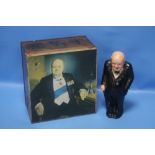 A WINSTON CHURCHILL FIGURE (NO MAKER'S MARK AND MISSING CIGAR) TOGETHER WITH A METAL TIN ALSO