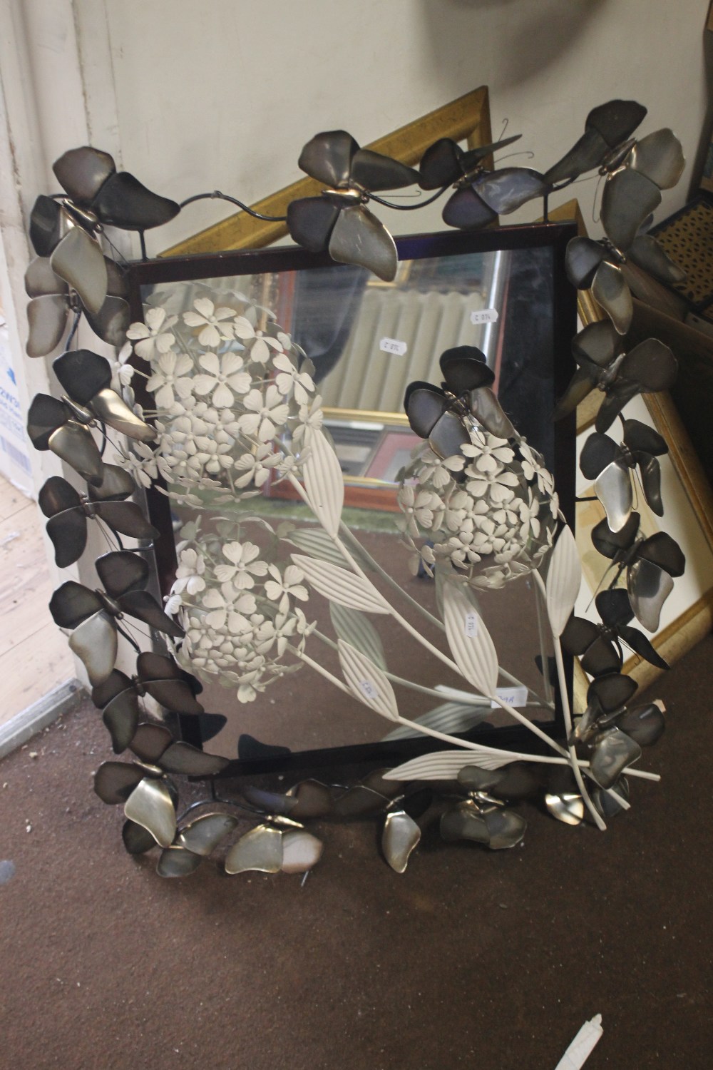 A MODERN MIRROR DECORATED WITH BUTTERFLIES TOGETHER WITH A WALL ART FLOWER A/F