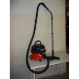 A HENRY HOOVER WITH ATTACHMENT