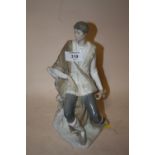 A VINTAGE LLADRO FIGURE OF A SEATED GENTLEMAN WITH IMPRESSED BACK STAMP