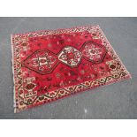 A VINTAGE EASTERN WOOLLEN RUG 159 X 120 CM