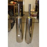 A PAIR OF MODERN TALL METAL BOTTLE SHAPED VASES HEIGHT - 75CM