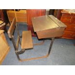 A VINTAGE CHILDS SCHOOL DESK WITH INTEGRATED SEAT