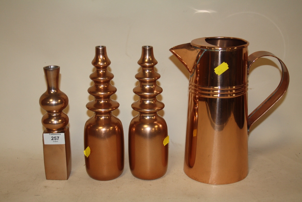 A PAIR OF MODERN COPPER EFFECT VASES TOGETHER WITH ANOTHER AND A COPPER EFFECT JUG (4)