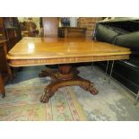 A WILLIAM IV MAHOGANY RECTANGULAR TILT-TOP TABLE RAISED ON AN OCTAGONAL BALUSTER COLUMN AND