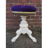 AN EDWARDIAN PAINTED CIRCULAR REVOLVING PIANO STOOL