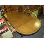 AN OAK ERCOL STYLE DROPLEAF DINING TABLE WITH SIX CHAIRS