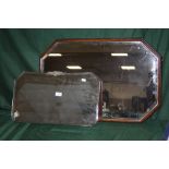 AN OAK FRAMED BEVEL EDGED OCTAGONAL WALL MIRROR, 77 CM BY 51 CM TOGETHER WITH ANOTHER 56CM X 33CM