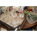 A TRAY OF CUT GLASS DRINKING GLASSES TO INCLUDE FUSHIA PATTERN EXAMPLES, VASE ETC