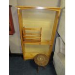 A HONEY PINE OPEN BOOKCASE WITH CARVED EASTERN STYLE TABLE AND A MAGAZINE RACK