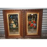 A PAIR OF VINTAGE OAK FRAMED FLORAL MIRRORS (ONE A/F) 82 CM BY 52 CM