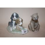 A LLADRO FIGURE OF A SEATED BROWN BEAR TOGETHER WITH A NAO FIGURE OF PUPPIES