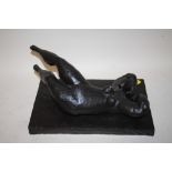 A MODERN DECORATIVE RESIN SCULPTURE OF A NUDE RECLINING FEMALE (LOOSE FROM BASE)