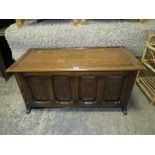 A CARVED OAK GOTHIC STYLE COFFER H-53 W-108 CM *NOTE SIDE PANEL LOOSE A/F