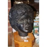 A PLASTER BUST OF LADIES HEAD RAISED ON WOODEN PLINTH, OVERALL HEIGHT 39 CM