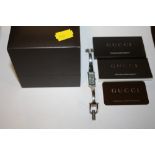 A BOXED LADIES GUCCI WRISTWATCH WITH WARRANTY PAPERS