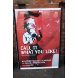 A LARGE FRAMED AND GLAZED BANKSY 'CALL IT WHAT YOU LIKE' COLLECTION RIK REINKING PRINT OVERALL