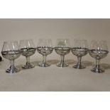 A SET OF SIX SMALL SILVER BASED DRINKING GLASSES STAMPED 925