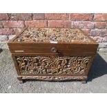 A CARVED TEAK HINGED BOX H-33 W-53 CM