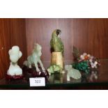THREE MODERN CARVED JADE STYLE ANIMAL FIGURES, TOGETHER WITH A MALACHITE FIGURE OF A LION,