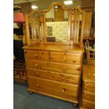 A DUCAL HONEY PINE FOUR DRAWER CHEST AND A MIRROR W-86 CM