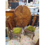AN ANTIQUE WALNUT / MAHOGANY TILT-TOP TABLE WITH TWO LATER CHAIRS (3)