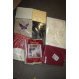 A QUANTITY OF PACKAGED BED SHEETS ETC.