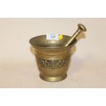 A VINTAGE BRASS PESTLE AND MORTAR