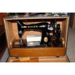 A CASED VINTAGE SINGER SEWING MACHINE