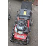 A MOUNTFIELD PETROL LAWNMOWER WITH GRASS BOX