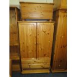 A HONEY PINE COMBINATION WARDROBE ** DRAWER MISSING** TOGETHER WITH A PINE BLANKET BOX (2)