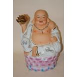 A LARGE MODERN CERAMIC FIGURE OF A SEATED BUDDHA - HEIGHT 39CM