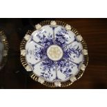 AN ANTIQUE COALPORT BLUE, WHITE AND GILT RIBBON PLATE ON STAND