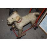 A VINTAGE CHILDS PUSH ALONG DOG TOY MADE BY LINES BROS OF IRELAND