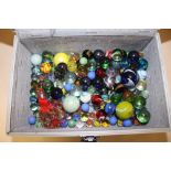 A SMALL HARD CASE OF MARBLES