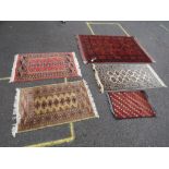 A SELECTION OF FIVE EASTERN WOOLLEN RUGS - LARGEST 146 X 104 CM