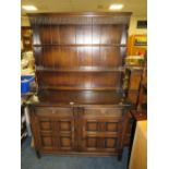 A VINTAGE DARK WELSH STYLE DRESSER W-120 CM