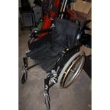A FOLD-UP WHEEL CHAIR WITH SELF PROPEL WHEELS