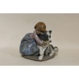 A MATTE FINISH LLADRO FIGURE OF A GIRL WITH A DOG STAMPED 2200 TO BASE HEIGHT - 16.5CM