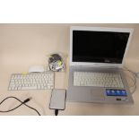 A SONY VAIO LAPTOP TOGETHER WITH AN APPLE KEYBOARD AND MOUSE ETC A/F