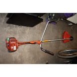 A HUSQVARNA PETROL STRIMMER